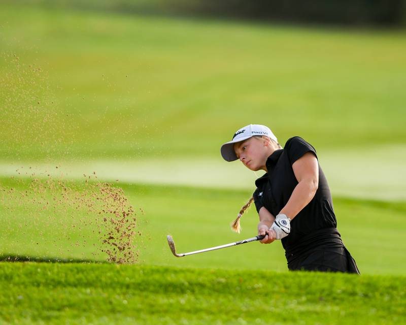 Brooklynn Griffith of Plainfield North hits out of the sand trap during the Southwest Prairie conference meet on Wednesday Sept. 24, 2025, held at Blackberry Oaks Golf course in Bristal.
