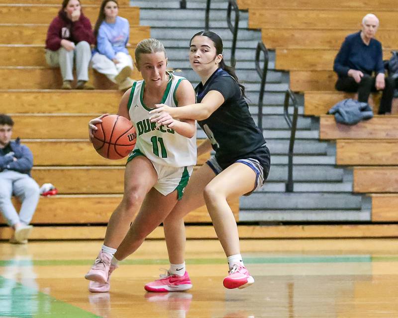 York's Briley O'Brien (11) drives baseline in their York Thanksgiving Tournament game between Oswego East at York on Monday, Nov 18, 2024  in Elmurst.