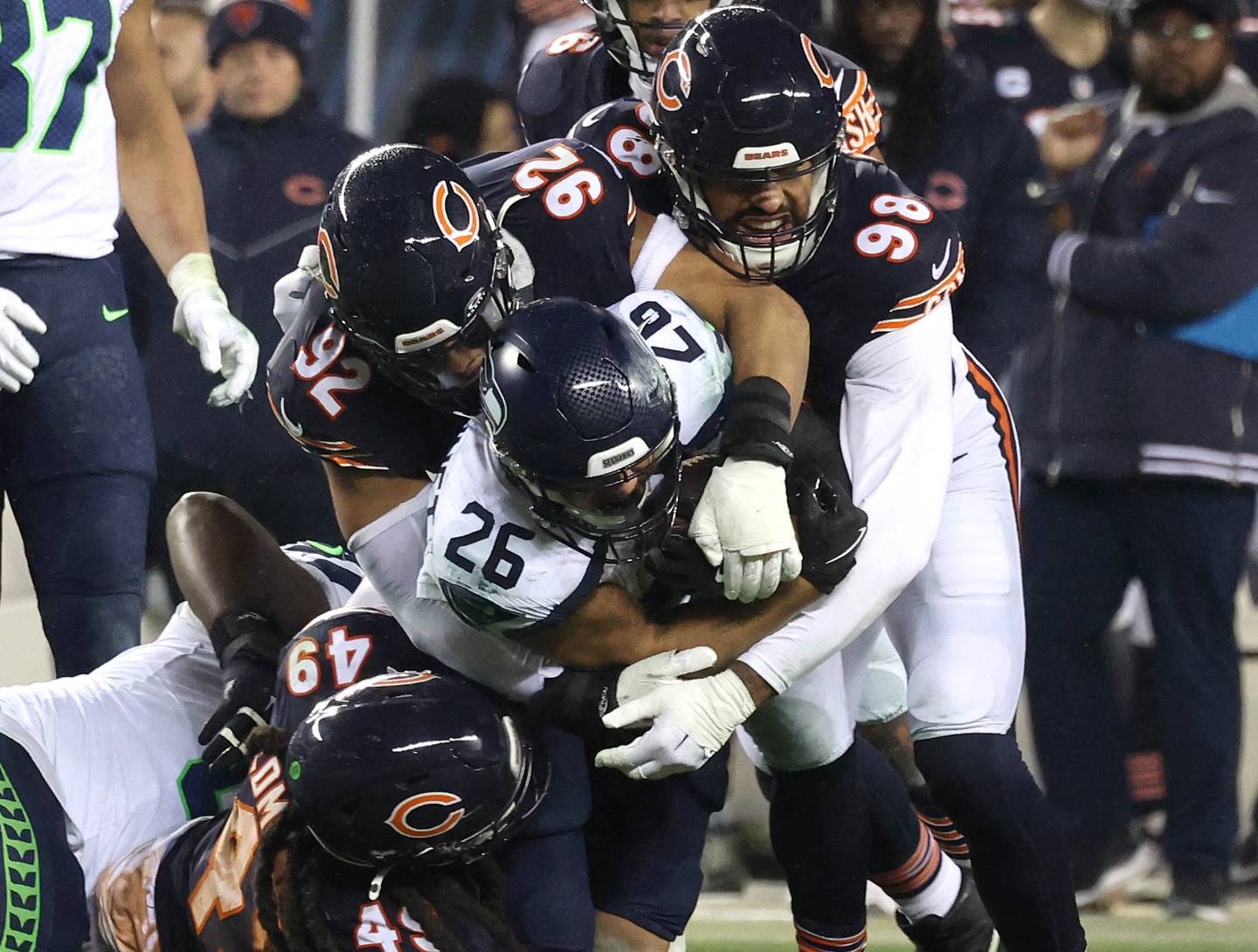 Members of the Chicago Bears defense swarm to tackle Seattle Seahawks running back Zach Charbonnet during their game Sunday, Dec. 26, 2024, at Soldier Field in Chicago.
