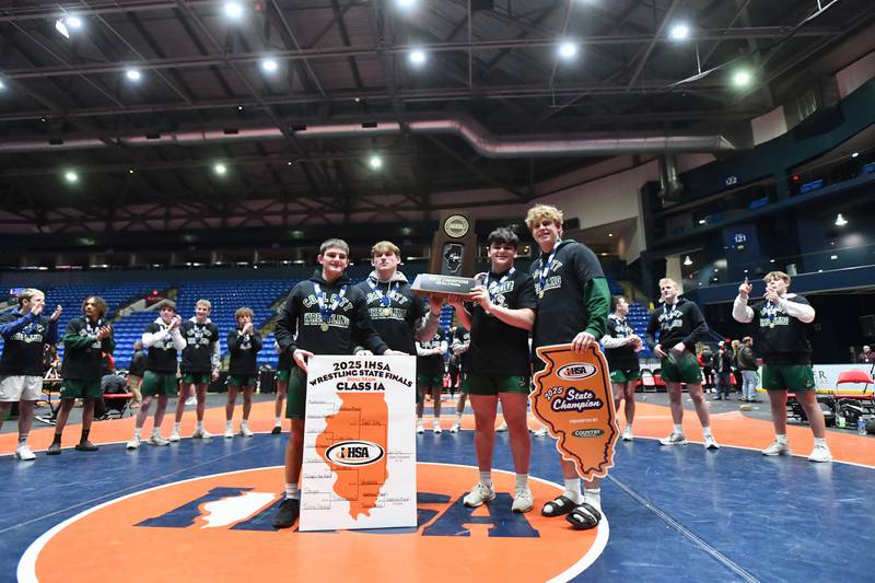 Coal City captains receive the Class 1A championship trophy at the IHSA Dual Team State Finals on Saturday, March 1.