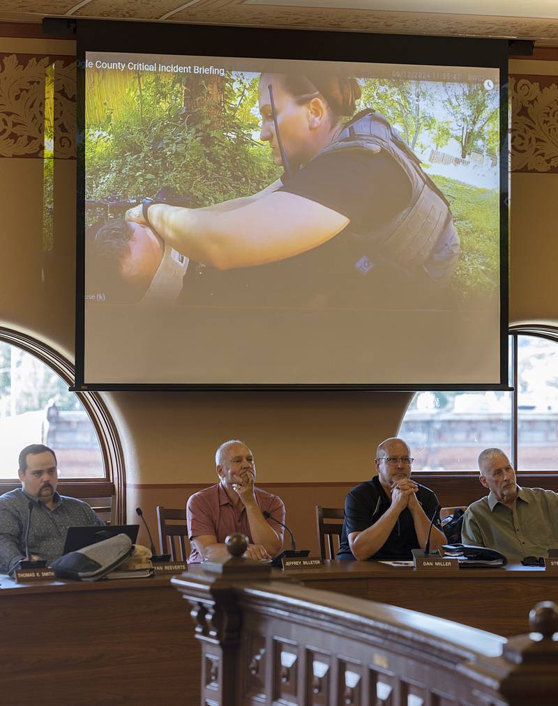 Ogle County board members watch body cam video Tuesday, June 18, 2024 from last week’s shooting at Lost Lake. Sheriff Brian VanVickle presented the board with the video.