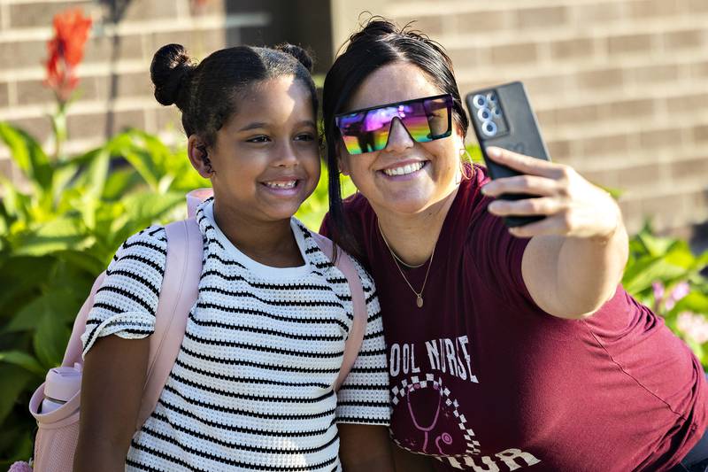 Megan Maas snaps a selfie with daughter KaMilla, a second grader starting her first day Thursday, August 14, 2025, at Jefferson School.