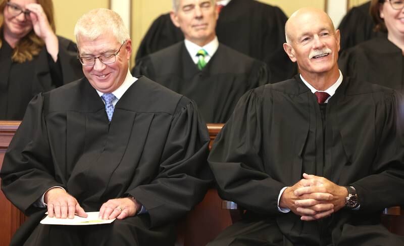 Judge Philip Montgomery (left) and Illinois Supreme Court Justice Michael Burke have a laugh as Judge Bradley Waller makes some remarks before swearing in Montgomery as a circuit court judge for the 23rd Judicial Circuit Court Friday, July 15, 2022, at the DeKalb County Courthouse in Sycamore.