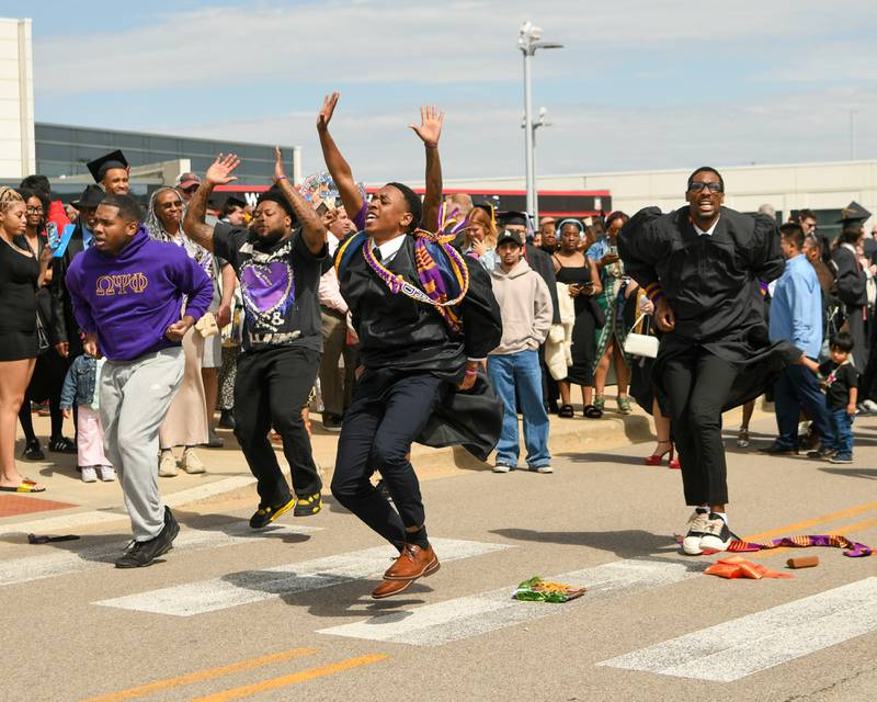 Northern Illinois University members from the Omega Psi Phi fraternity do a routine after the Northern Illinois University graduation ceremony on Saturday May 9, 2026, held at the Convocation Center in DeKalb.