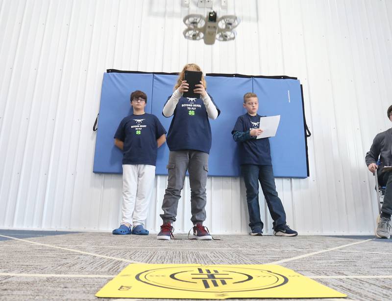 (From left), Jackson Nauman of Henry, Calvin Movera of Henry and Heath Hardy of Princeton, fly their drone through obstacles during a drone competition on Saturday, Nov. 22, 2025 at the Second Story Teen Center in Princeton. Teams from Bureau, La Salle and Marshall-Putnam counties came together to showcase their flying skills during the event. Second Story Teen Center partnered with the University of Illinois Extension of Bureau, La Salle Marshall and Putnam Counties. Drones and awards were purchased through a grant and donations from Compeer Financial.