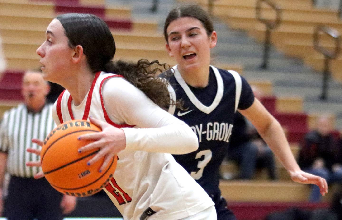Huntley’s Luca Garlin gets past Cary-Grove’s Kennedy Manning in varsity girls basketball on Monday, Feb. 2, 2026, at Huntley High School in Huntley.