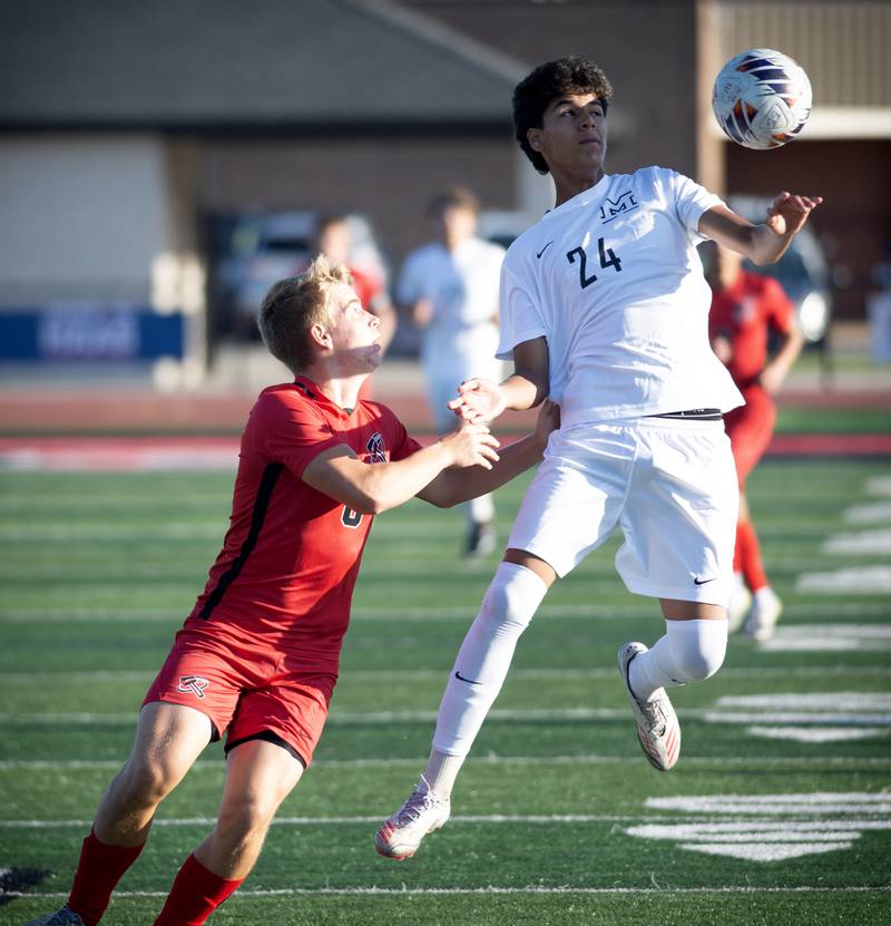 Minooka's Aldo Escobedo, right, plays the ball as Bradley-Bourbonnais' Jack Watters defends in a game on Tuesday, August 26, 2025.