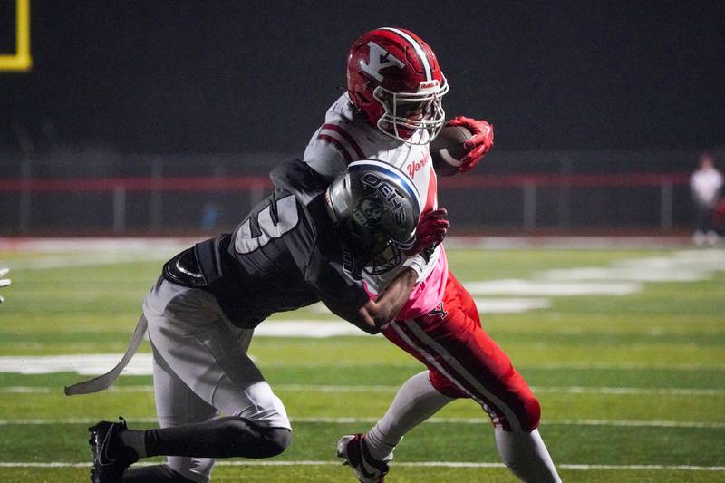 Oswego East's Andre Cobige Jr. (3) tackles Yorkville's Josh Gettemy (4) during a football game at Yorkville High School on Friday, Oct. 13, 2023.