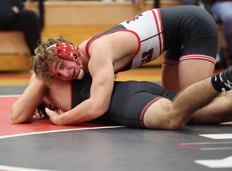 Yorkville's Luke Zook goes up against against Plainfield North's Julian De La Rossa during the Southwest Prairie Conference wrestling meet at Yorkville High School on Saturday, Jan. 21, 2023.