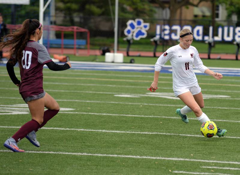 Hinsdale Central's Peyton Rohn defends the ball against Morton West during the regional final game held Saturday May 21, 2022.