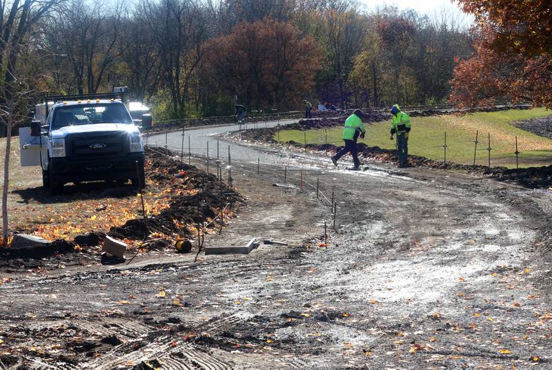 Crews with Gillian Construction repair the walking path around Baker Lake on Monday, Nov. 10, 2025 in Peru. The walking path is nearly half poured. It's been one-month since construction began. Work includes a 10-foot wide concrete path with secondary concrete paths also added, connecting with the new parking lot near Lighted Way and connecting with the parking lot, playground, and shelter on the west side of Baker Lake. The new path will be wider by 2 feet than the current one. The park remains closed to the public. The project will be completed in early December.