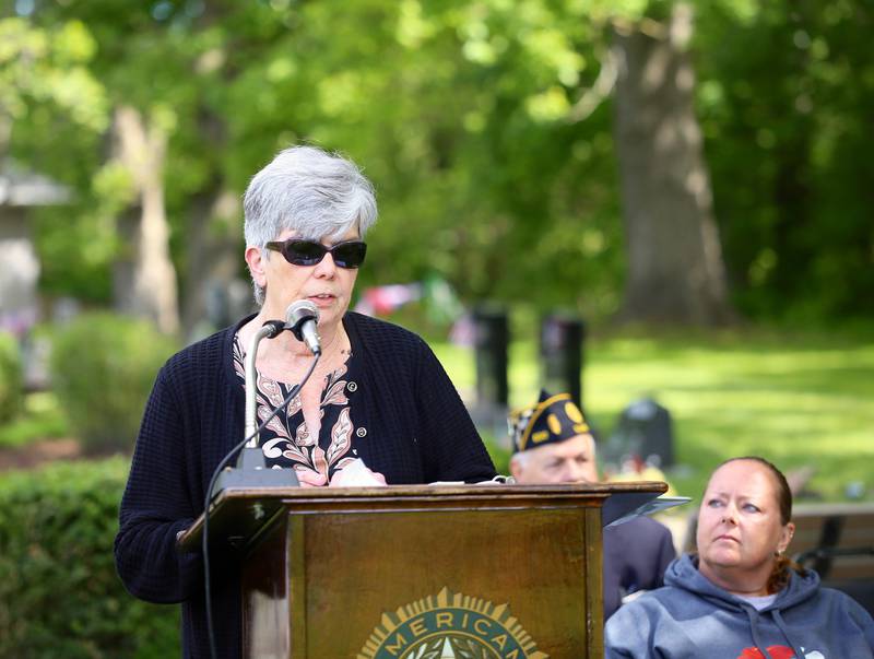 Karen Howard read the names of hundreds of fallen soldiers in wars who were connected to Elburn at the Elburn American Legion Annual Memorial Day Observance at the Blackberry Township Cemetery on Monday, May 26, 2025.