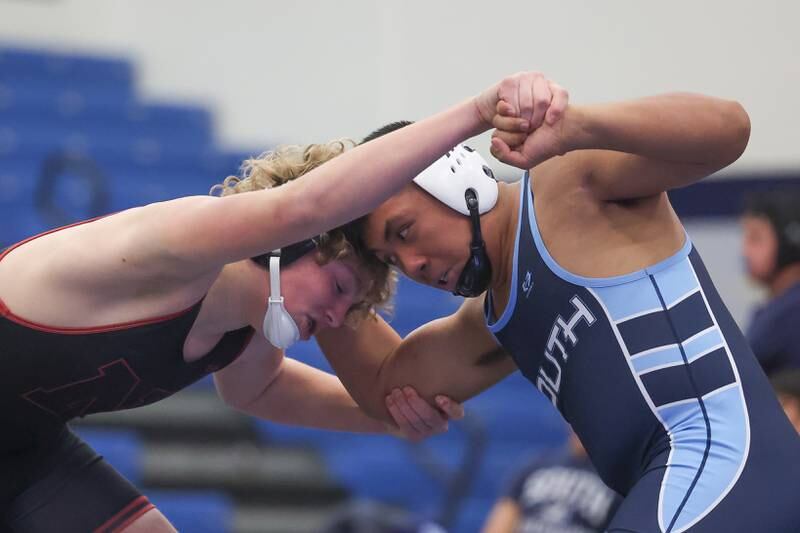 Plainfield North’s Jack Nowicki wrestles with Plainfield South’s Kyle Ochotorena in a Southwest Prairie dual meet on Wednesday, Nov. 29, 2023 in Plainfield.