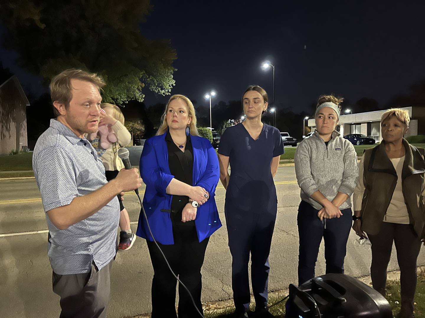 John Fitzgerald (left), staff representative for nurses at Ascension Saint Joseph Medical Center, speaks to a crowd about the staffing situation at the hospital on Saturday, Oct. 22, 2022. Standing next to him is Julia Bartmes, Illinois Nurses Association executive director, Katherine Soprych, an Intensive Care Unit nurse, Hannah Puhr, an emergency room nurse and Pat Meade, treasurer for the St. Joseph Nurses Association.