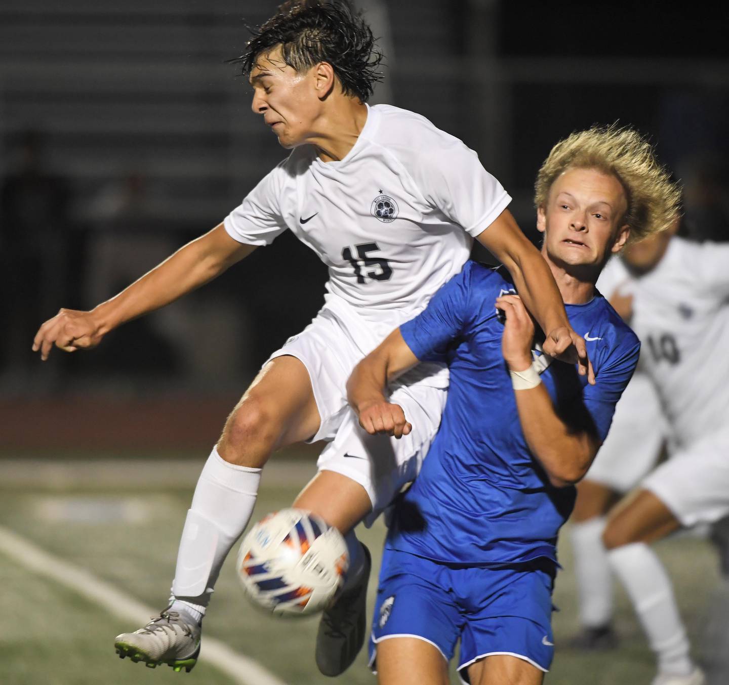 West Chicago’s Donovan Avila, left, and St. Charles North’s Trevor Mirra compete for the ball in a boys soccer game in St. Charles on Wednesday, August 30, 2023.