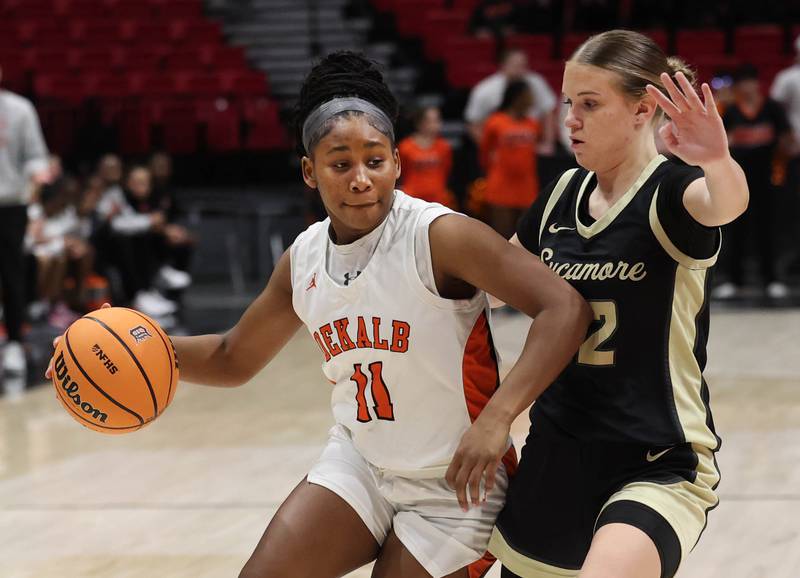 DeKalb's Johnna Patrick works against Sycamore's Quinn  Carrier Friday, Jan. 30, 2026, during their game in the FNBO Challenge in the Convocation Center at Northern Illinois University in DeKalb.