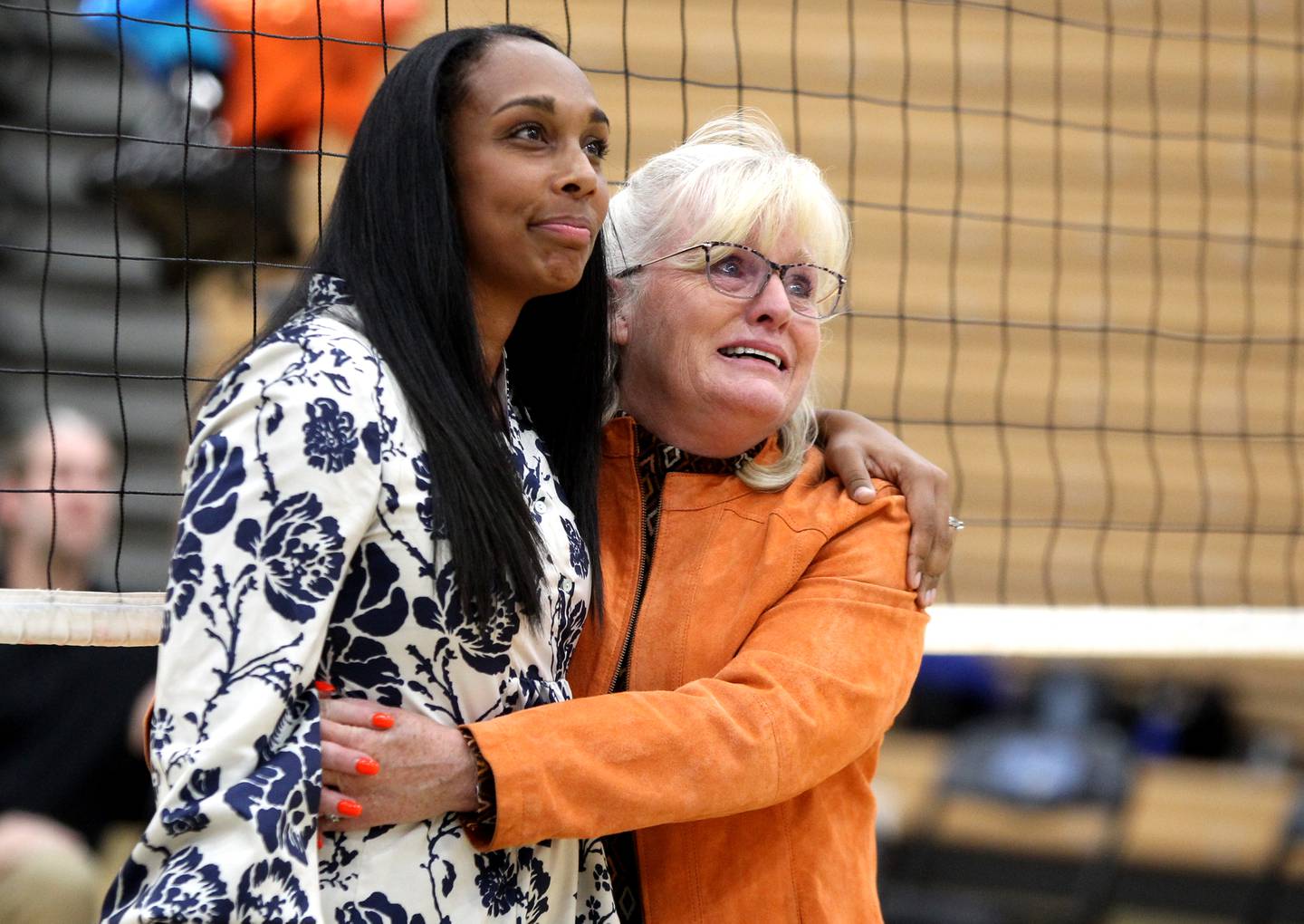 St. Charles East head girls volleyball coach Jennie Kull (right) embraces St. Charles North head coach Lindsey Hawkins during a tribute in honor of Kull’s final season at St. Charles North on Tuesday, Oct. 4, 2022.
