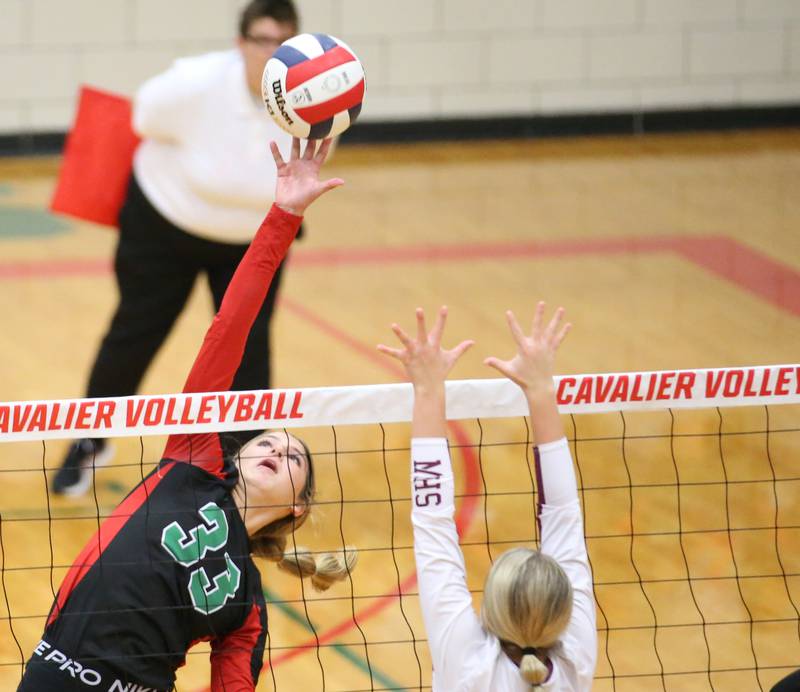 L-P's Kelsey Fredrick sends a spike past Morris's Ayla Phillips in the Class 3A Regional game on Thursday, Oct. 26, 2023 at Sellett Gymnasium.