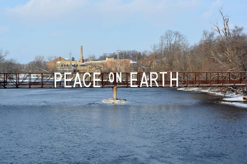 In 2008, the “Peace on Earth” sign made its inaugural appearance on the pedestrian bridge in downtown Batavia. The sign was officially dedicated during the Celebration of Lights Festival on Dec. 1. (Shaw Local provided file photo)