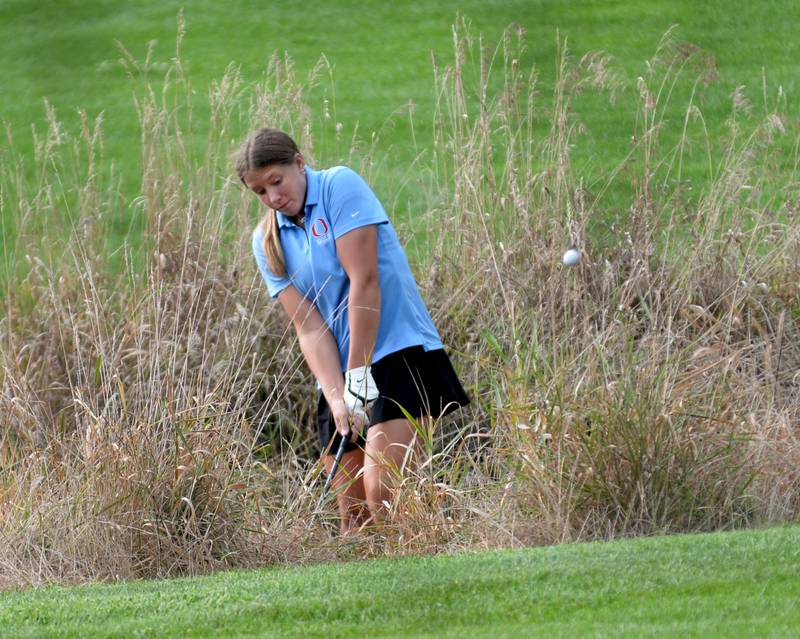 Oregon's Aniyah Sarver chips out of the rough on Monday, Aug. 18, 2025 against Erie-Prophetstown at Silver Ridge Golf Course north of Oregon.