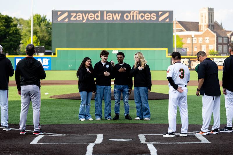 Members of the Lockport Township High School singing group Off the Record, Gabriella Delara, Brodie Bartels, Zachariah Pitchford, and Brooklyn Drab, sing the national anthem prior to the first pitch of the home opener of the Joliet Slammers on Friday, May 8, 2026.