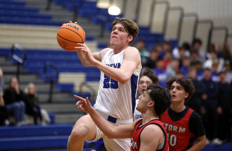 Geneva’s Hudson Kirby gets through a pair of South Elgin defenders during a game on Monday, Nov. 25, 2024 in Geneva.