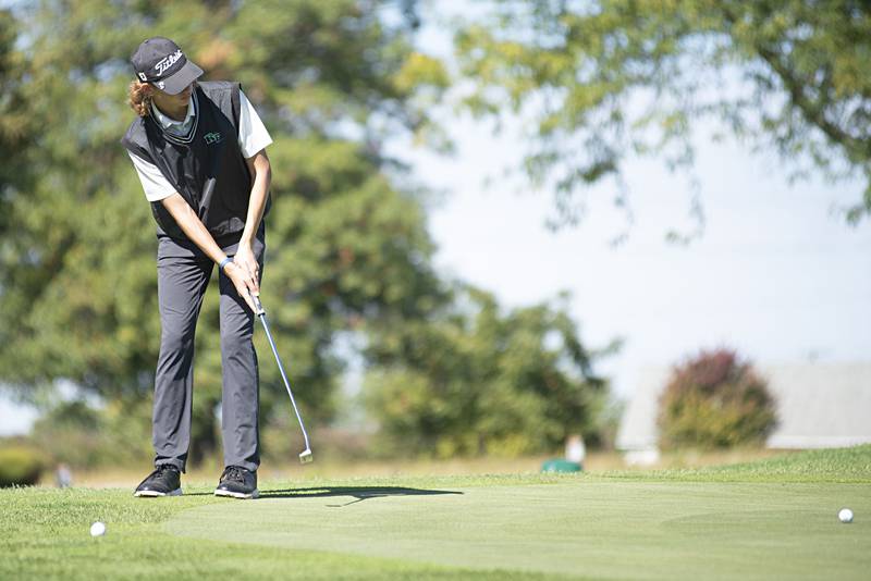 Rock Falls’ Carter Dillon putts on no. 3 at Emerald Hill in Sterling for the Class AA IHSA sectional golf meet.