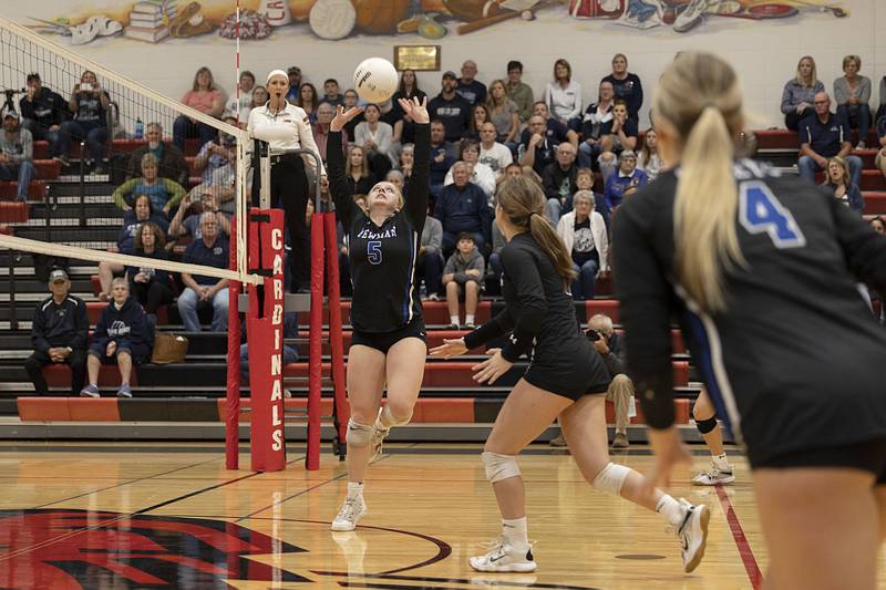 Newman’s Molly Olson sets the ball late in the second set Wednesday, Nov. 2, 2022 in the sectional championship game against River Ridge.