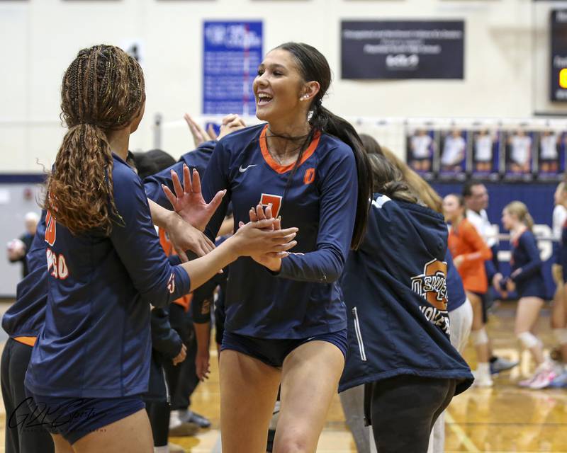 Oswego's Hannah Herrick (7) and teammates celebrate their victory over Neuqua Valley in their Class 4A Regional Final volleyball match. Oct 30, 2025 in Plainfield.