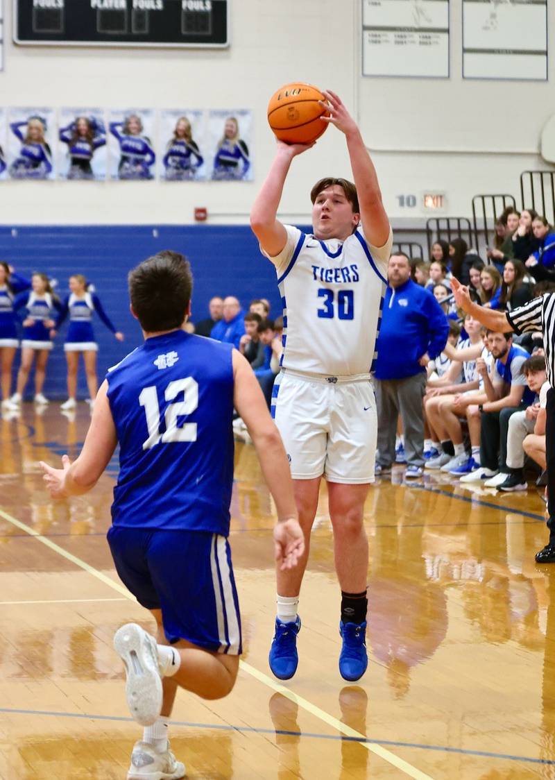 Princeton senior Jordan Reinhardt spots up for a 3-pointer Friday night at Prouty Gym. The Tigers beat Newman 60-46.