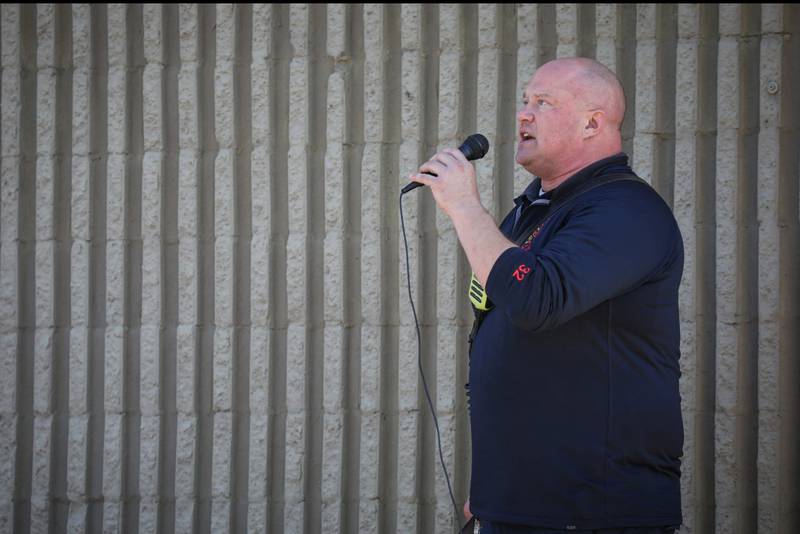 Woodstock Fire Lt. Eric Kristensen performs the national anthem before a Sept. 11 anniversary ride in Woodstock Sept. 6, 2025.