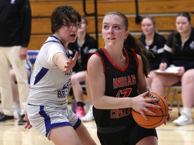 Indian Creek's Bethany Odle goes baseline against Hinckley-Big Rock's Grace Hall during their game Thursday, Jan. 29, 2026, at Hinckley-Big Rock High School.