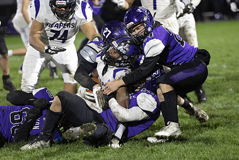 The Dixon defense stops Plano’s Waleed Johnson Friday, Oct. 27, 2023 in Dixon.