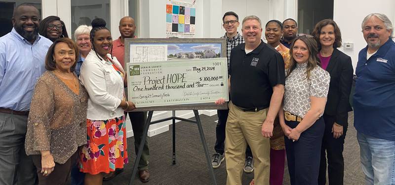 DeKalb County Community Foundation staff and board members presenting a spring 2024 community needs grant to Project HOPE representatives