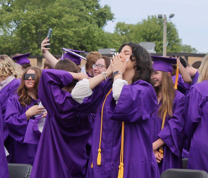 A member of the Dixon High School Class of 2023 blows a kiss to the crowd after Principal Jared Shaner presents the graduates on Sunday, May 28, 2023.