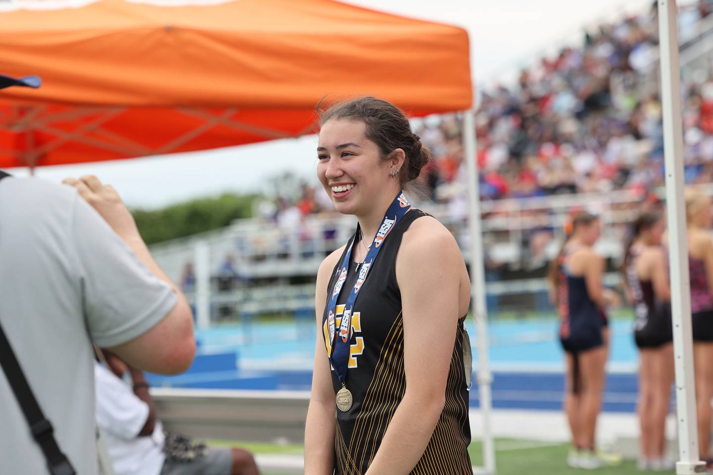 Reed-Custer's Sophia Burciaga smiles after receiving a medal during the IHSA Class 2A Girls Track & Field State Finals on Saturday, May 24, 2025.