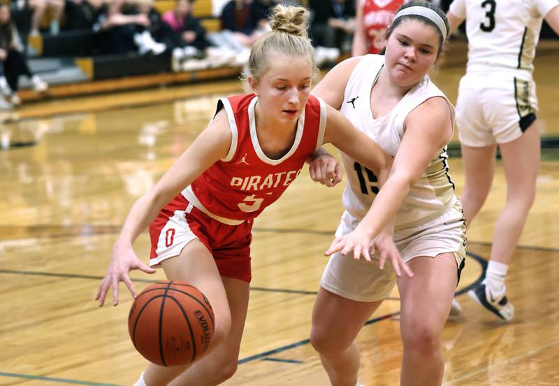 Ottawa's Grace Carroll gets by Sycamore's Sophia Klacik Wednesday, Jan. 4, 2023, during their game at Sycamore High School.