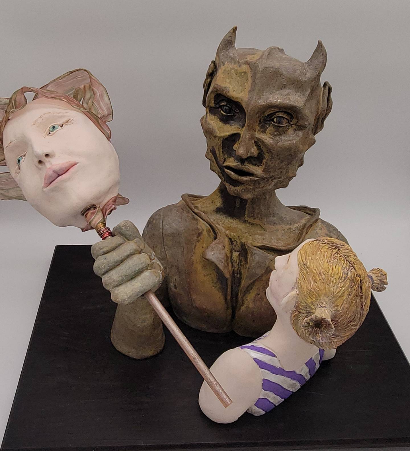 Mommy Monster: Wood-fired stoneware,
porcelain and mixed media sculpture
mounted on wood; 17x25x16, $550 by Jen Schroeder.