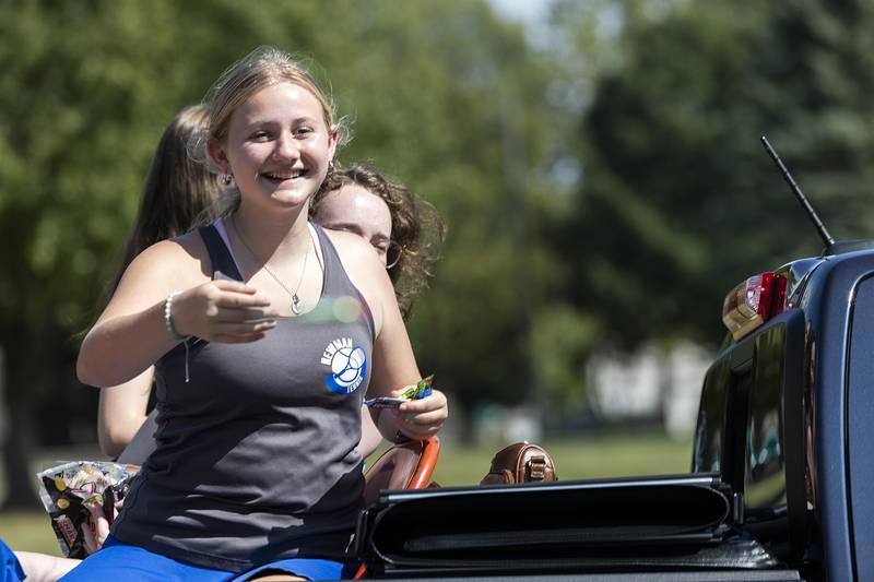 Tennis players throw candy from a float Friday, Sept. 12, 2025, during Newman High School’s homecoming parade in Sterling. The parade left the campus and circled Kilgour Park before heading back to the school.