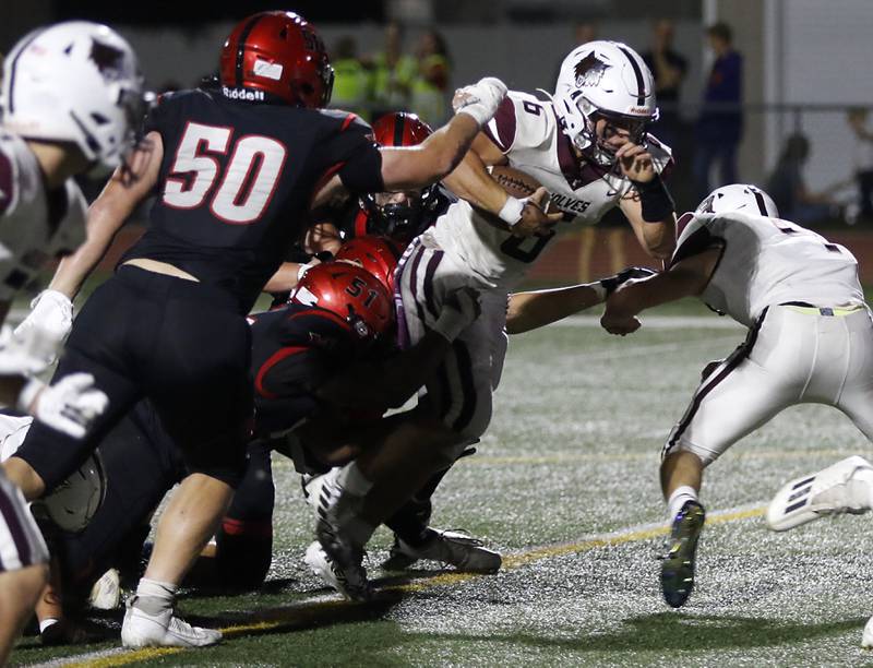 Prairie Ridge's Luke Vanderwiel breaks through the Huntley defensive line during a Fox Valley Conference football game on Friday, Sept. 20, 2024, at Huntley High School.