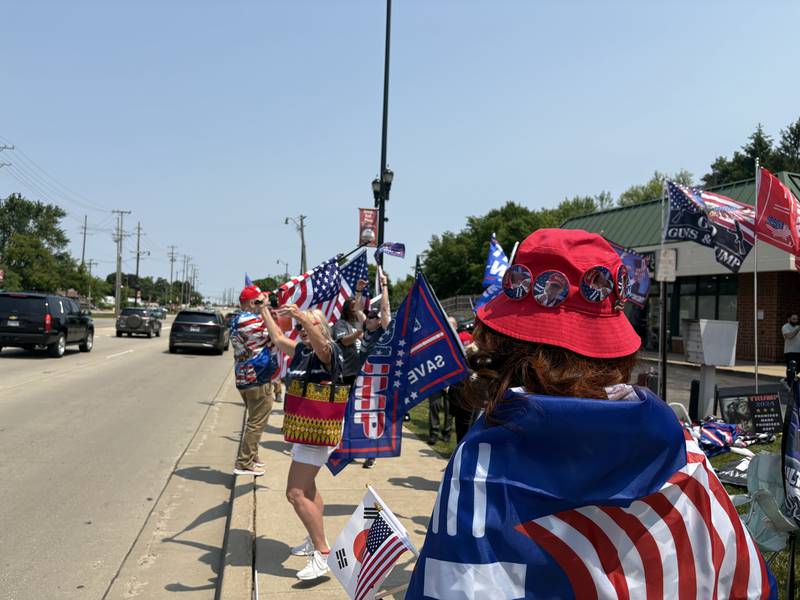 People rally outside the Trump and Truth Store in Huntley May 31, 2025.