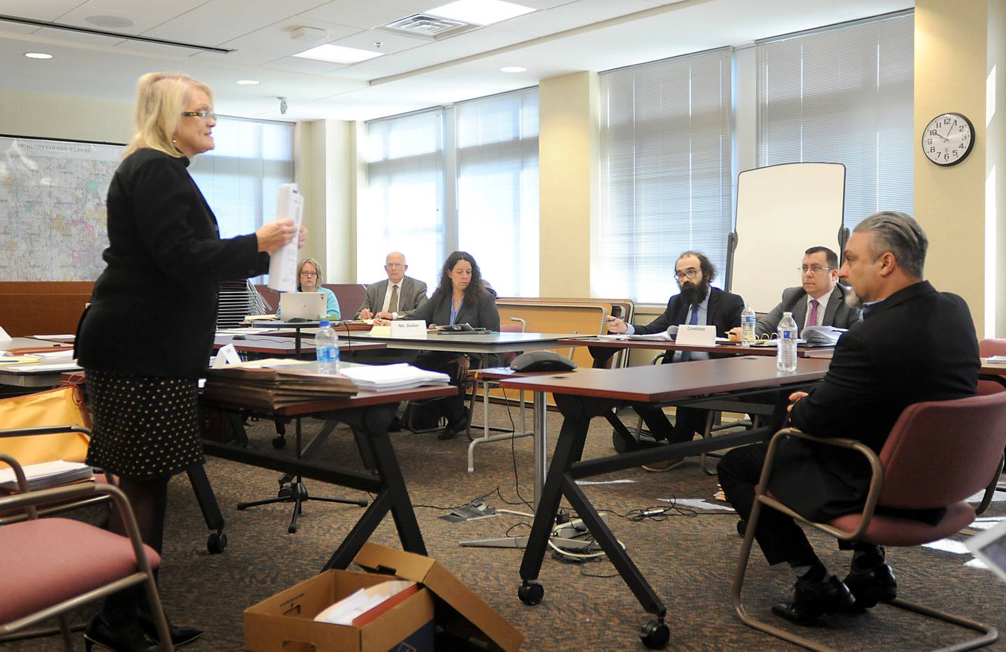 Attorney Keri-Lyn Krafthefer asks Tony Colatorti a question as he testifies Thursday, April 14, 2022, during a hearing of McHenry County electoral board at the McHenry County Administration Building in Woodstock. The board was to determine if Colatorti can remain on the ballot following an objection by William Brogan and Joel Brumlik over his qualifications to run for the position of McHenry County sheriff.