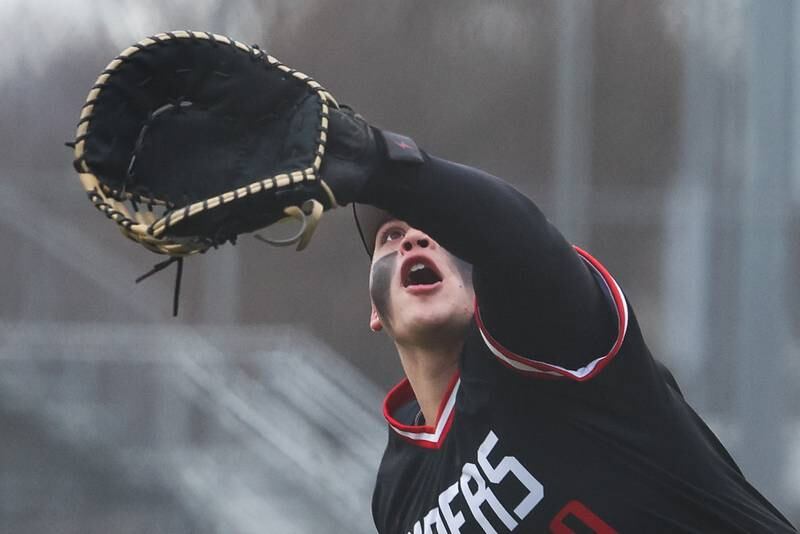 Bolingbrook’s Tommy Corley runs down a foul ball against Joliet Central on Tuesday, March 21st. 2023.