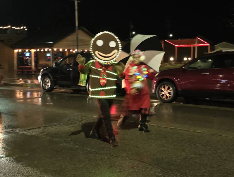 A lighted Gingerbread person makes its way Saturday, Dec. 14, 2024, along the Winter Wonderland parade route in downtown Oglesby.