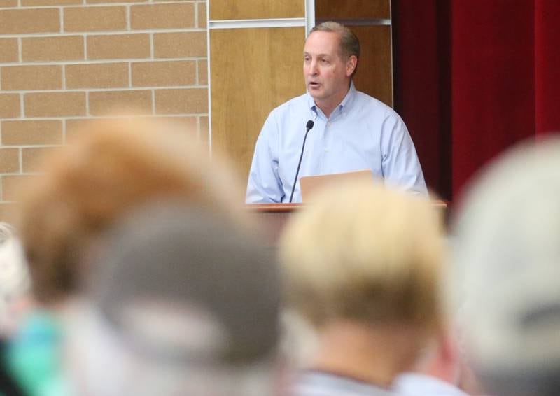 Ron Henson speaks to the Illinois Health Facilities and Services Review Board during a public hearing regarding OSF St. Elizabeth Hospital's plans to reduce services on Tuesday, June 10, at Central Intermediate School in Ottawa.