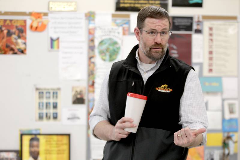 Batavia High School social studies teacher Scott Bayer during a recent class. Bayer is also the head coach of the school’s girls wrestling team.