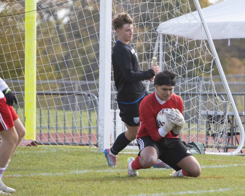 South Elgin's Christian Moscoso makes the sliding save against St. Charles North at the Class 3A Sectional Final on Saturday, Nov. 1,2025 in South Elgin.