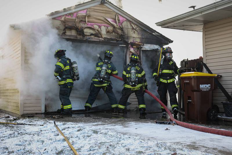 The Woodstock Fire/Rescue District puts out a fire that broke out in a detached garage on Jan. 14, 2026 at the 1300 block of Clay Street, Woodstock.