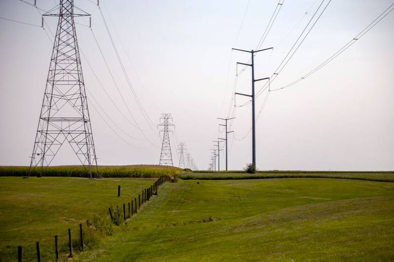 Power lines carry electricity over fields near Glasford.