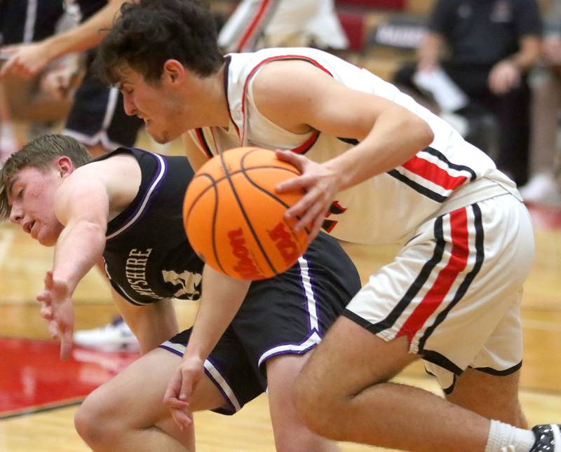 Huntley’s Casey Kaczmarski, front, hustles with he ball as Hampshire’s Tyler Lacke defends in varsity boys basketball on Friday, Dec. 19, 2025, at Huntley High School in Huntley.